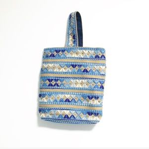 Large basket style bag. Embroidered on thatched